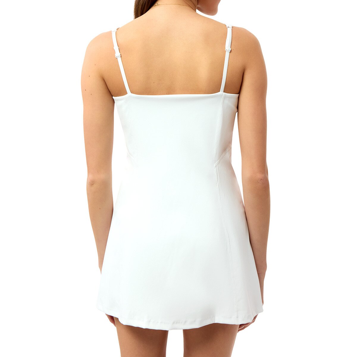 model wearing women's white active mini dress back view